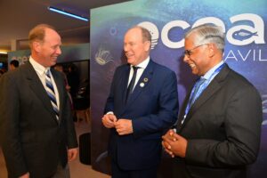 His Serene Highness the Sovereign Prince of Monaco talks to WHOI President Peter de Menocal and Director of the WHOI Marine Policy Center Dr. Kilaparti Ramakrishna at the Ocean Pavilion at COP28.
