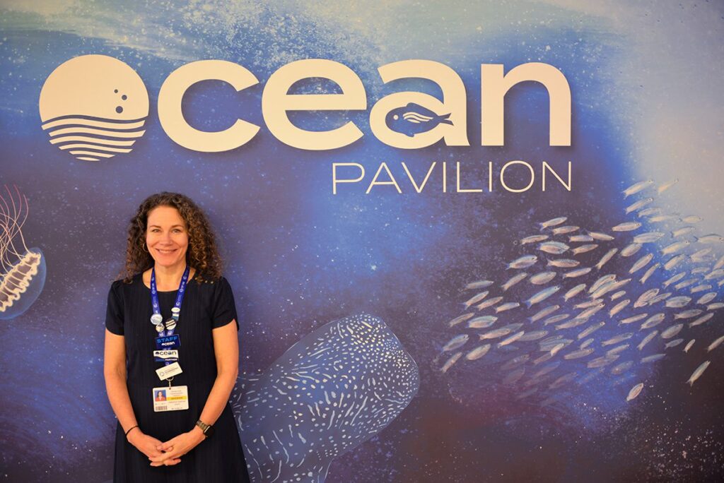 WHOI Director of Creative and Web, Katherine Spencer Joyce, poses outside of the Ocean Pavilion.