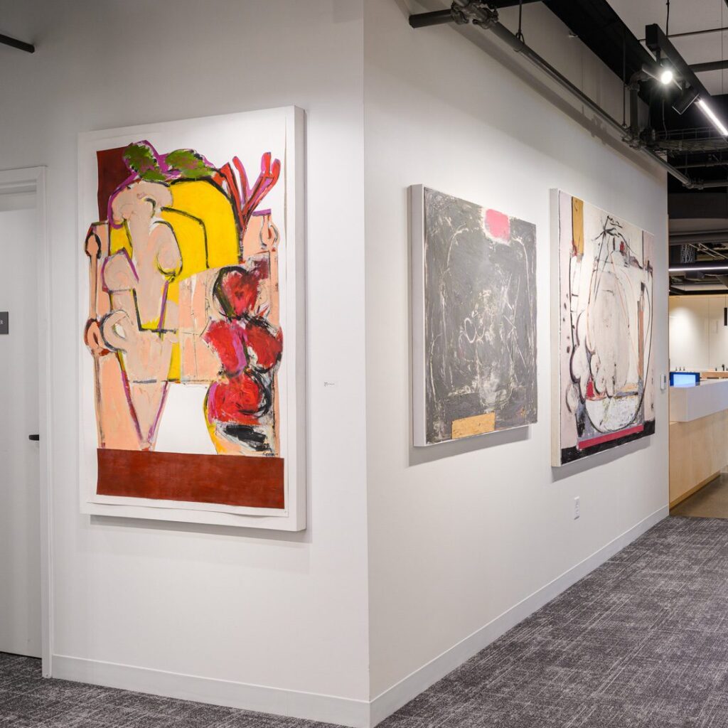 Paintings by Ruth Mordecai hang in the Paul Dietrich Gallery within the offices of architecture and design firm CambridgeSeven.